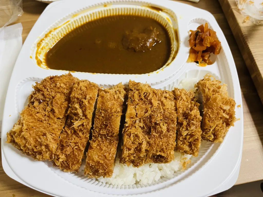 Large, golden-brown fried pork loin cutlet